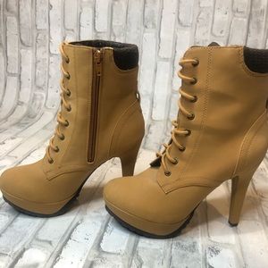 Camel coloured heeled boots that add some edge.
